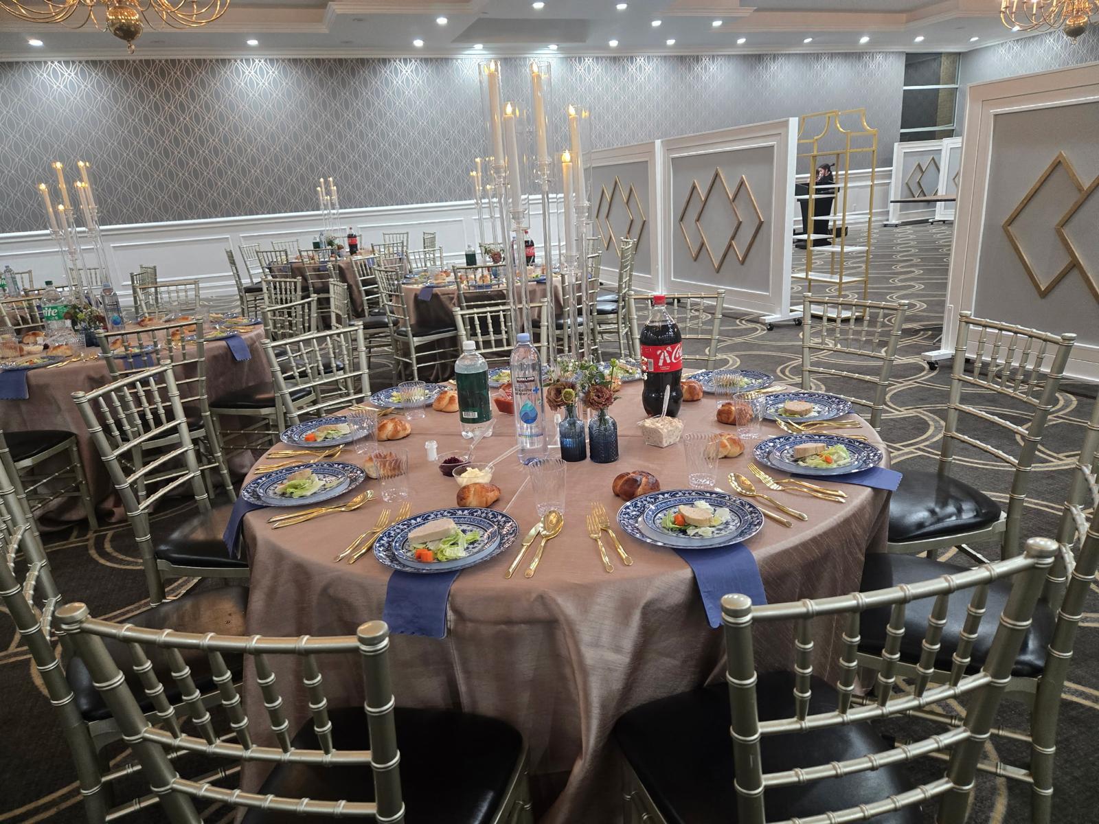 Round dinner tables with gold chiavari chairs