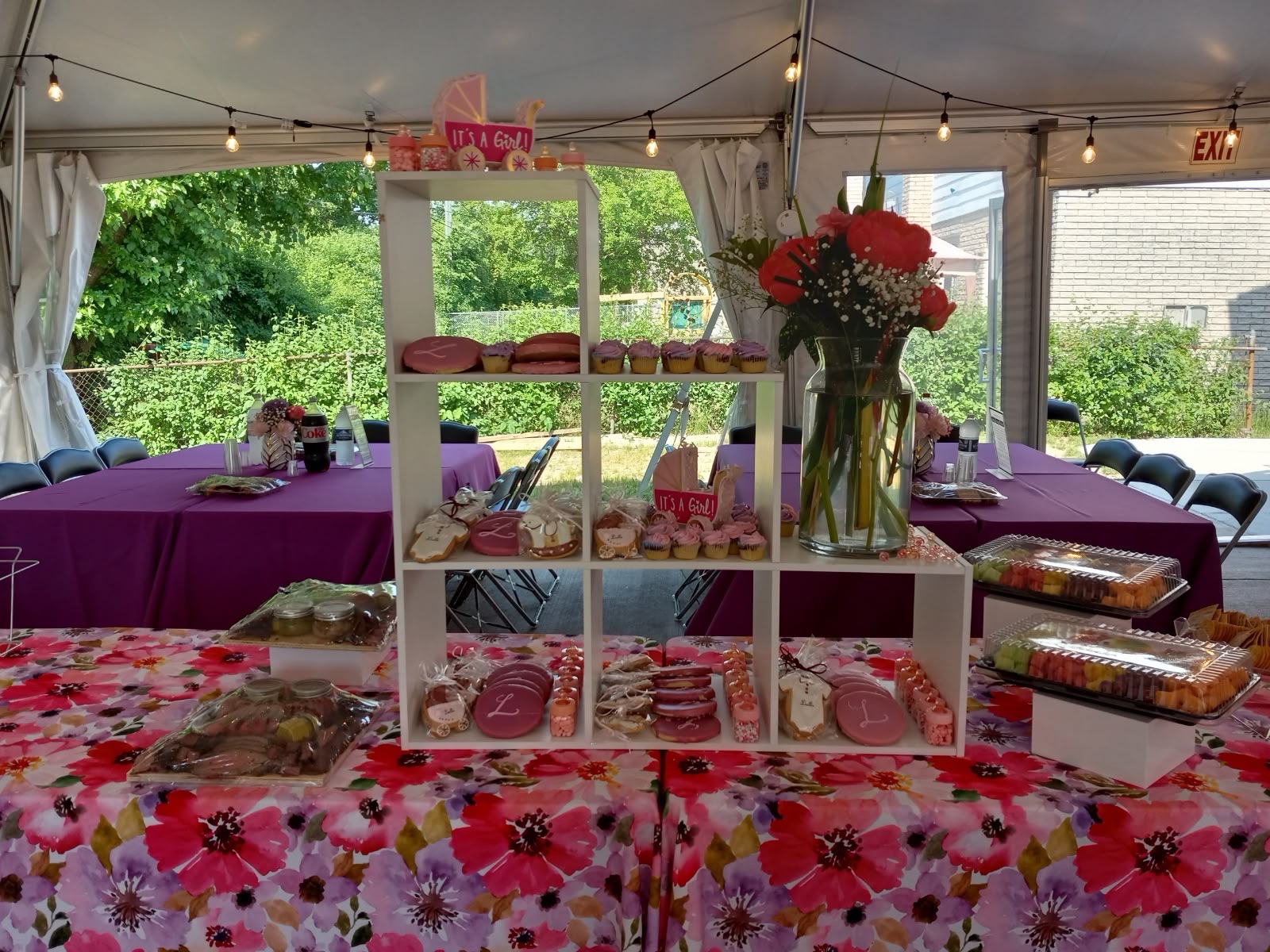 It's a Girl pink-themed dessert display with florals
